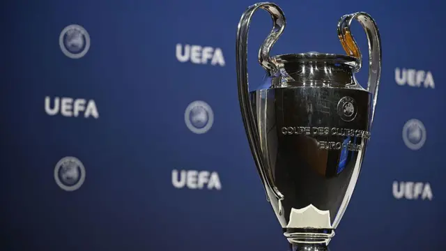 General view of Champions League trophy in front of Uefa background