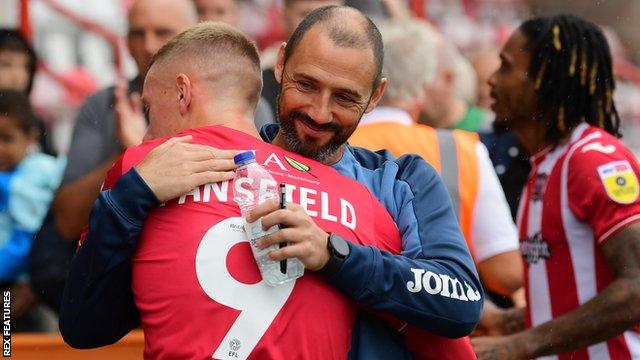 Jay Stansfield hug Wayne Carlisle