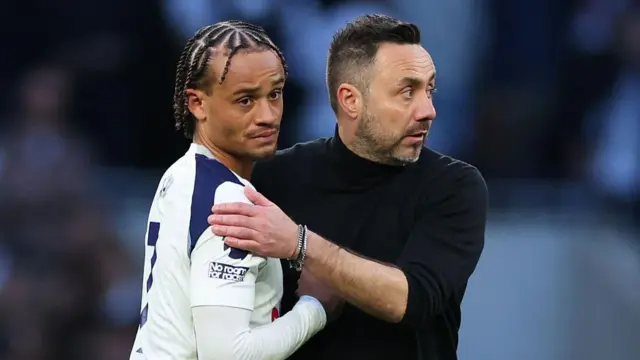 Roberto De Zerbi embraces a dejected Xavi Simons