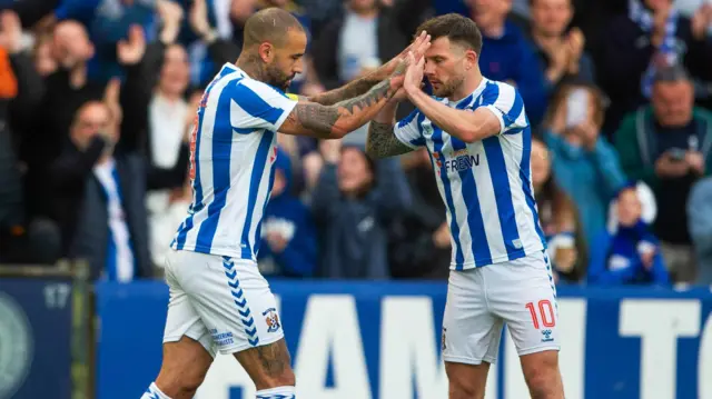 Kyle Vassell celebrates with Marley Watkins