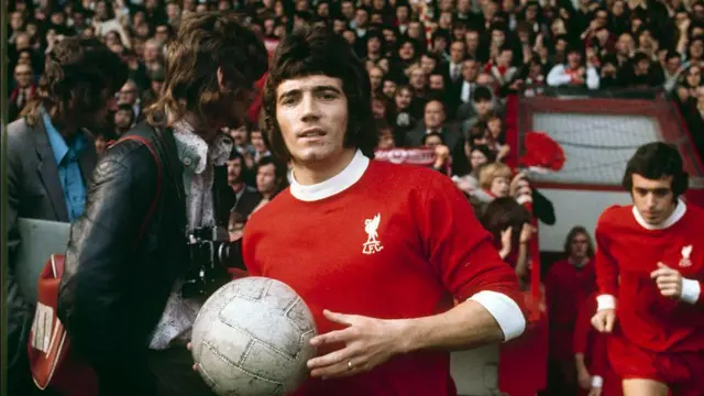 New Liverpool signing Kevin Keegan runs out with the ball in hand