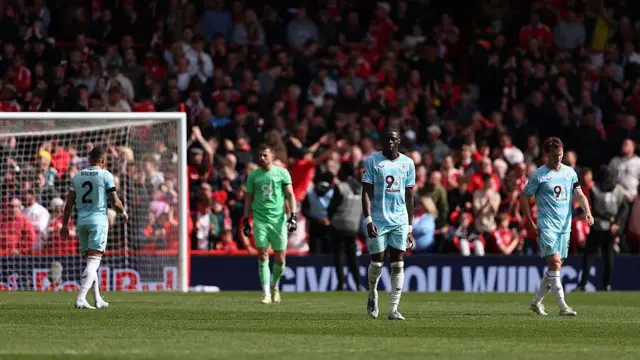 Burnley players look dejected after conceding a third goal