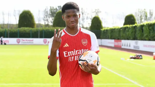 Chido Obi-Martin with the matchball after scoring a hat trick for Arsenal