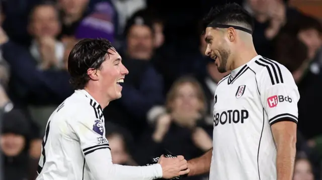 Fulham's Harry Wilson celebrates scoring their second goal with Raul Jimenez