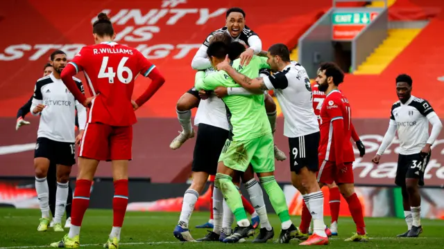 Fulham celebrate a goal at Liverpool