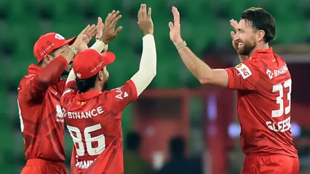 Richard Gleeson celebrates taking the wicket of Mohammad Rizwan during the Pakistan Super League (PSL) match between Rawalpindi and Islamabad United at Gaddafi Stadium in Lahore, Pakistan