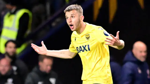 Stan Mills encourages his Oxford United teammates