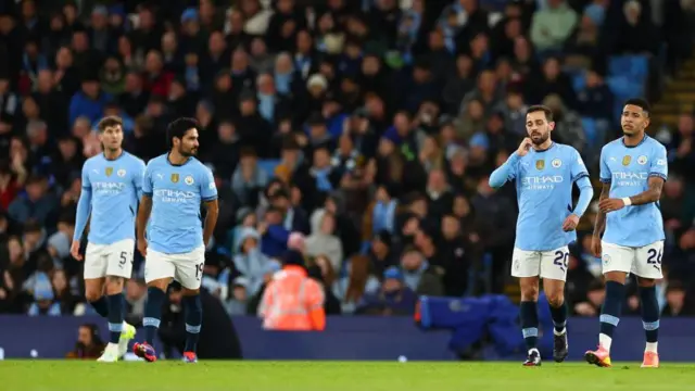 Dejected Manchester City players after James Maddison of Tottenham Hotspur scored