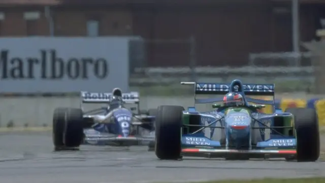 Michael Schumacher leads from Damon Hill