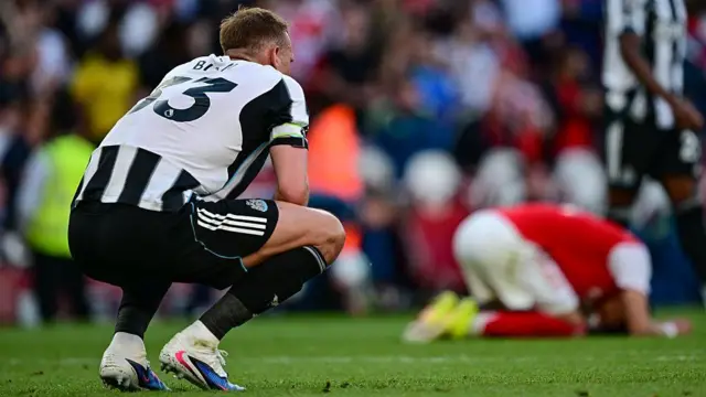 Dan Burn of Newcastle United reacts.