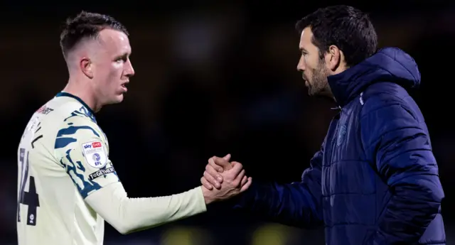 Midfielder David Turnbull shakes hands with Cardiff City boss Brian Barry-Murphy