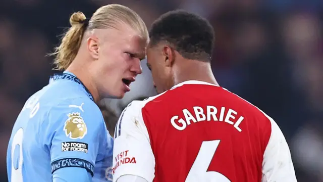 Erling Haaland and Gabriel face up to each other during match