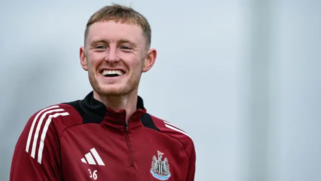 Sean Longstaff laughs during a Newcastle training session