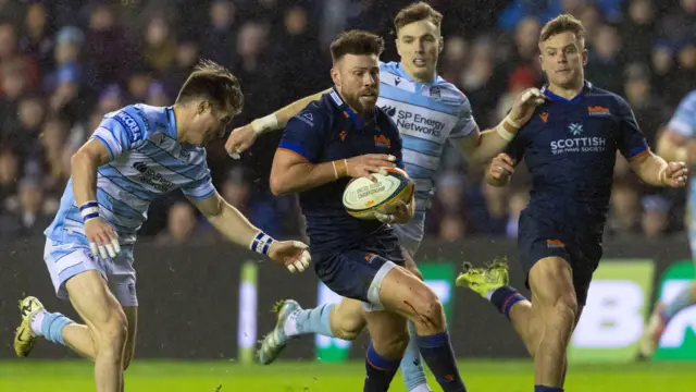 Warriors' George Horne tackles Edinburgh’s Ali Price during a United Rugby Championship match between Edinburgh Rugby and Glasgow Warriors