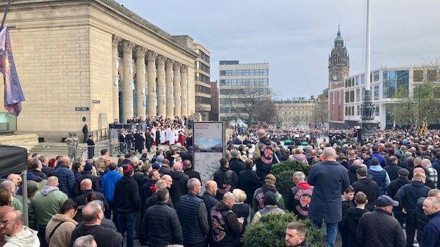 Crowds stand in Sheffield looking towards Barker’s Pool.