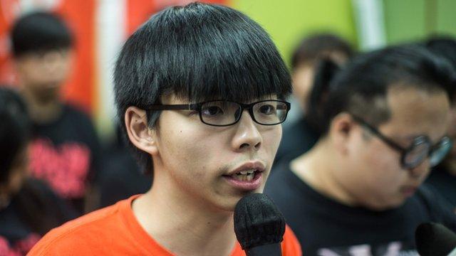 Student protester Joshua Wong (C), 19, speaks as he and other members of pro-democracy campaign group Scholarism hold a press conference regarding the group's future plans in Hong Kong on 20 March 2016.