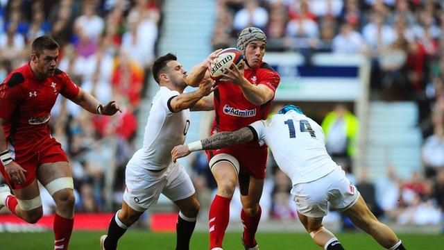 Jonathan Davies of Wales is tackled by Danny Care and Jack Nowell of England in the Six Nations match between England and Wales at Twickenham in 2014.