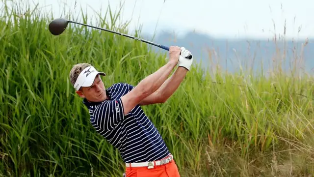 Luke Donald plays a shot