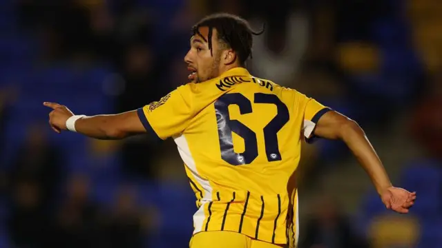 Remiero Moulton runs off in celebration after scoring for Brighton and Hove Albion Under-21s at AFC Wimbledon in the Bristol Street Motors Trophy