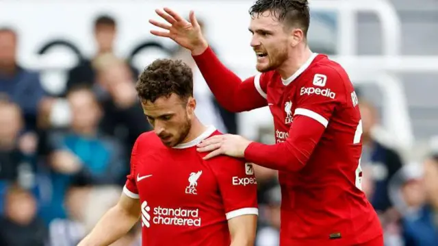 Andy Robertson embraces Diogo Jota