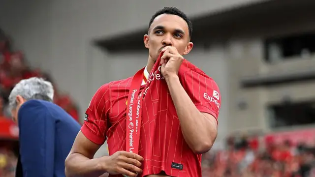 Trent Alexander-Arnold kisses the Liverpool badge on his shirt