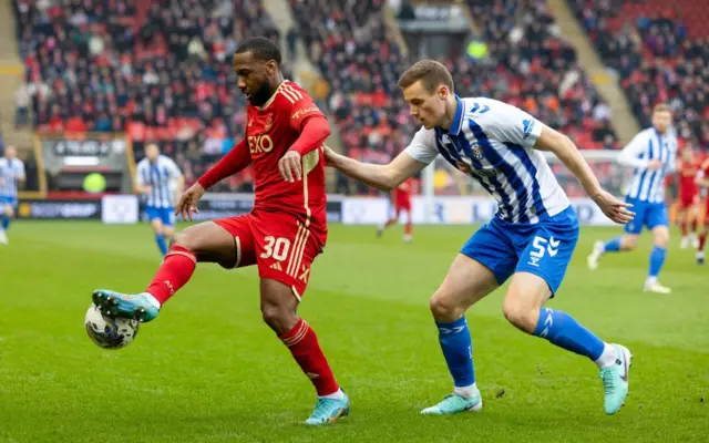 Aberdeen's Junior Hoilett and Kilmarnock's Lewis Mayo in action during a Scottish Cup Quarter Final match between Aberdeen and Kilmarnock at Pittodrie Stadium, on March 09, 2024, in Aberdeen, Scotland.