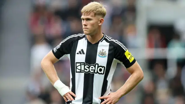 Lewis Hall looks on during match for Newcastle