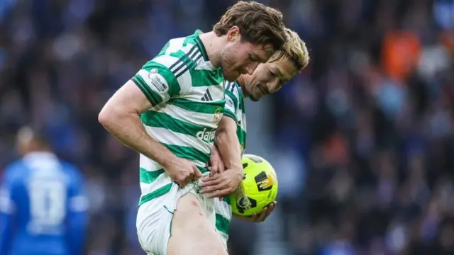 Celtic's Anthony Ralston shows his injury to Daizen Maeda