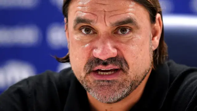 Daniel Farke answers a question at a news conference