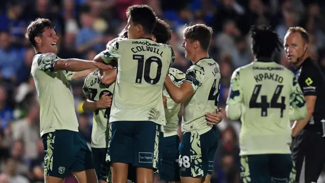 Cardiff players celebrate their late winner at Wimbledon