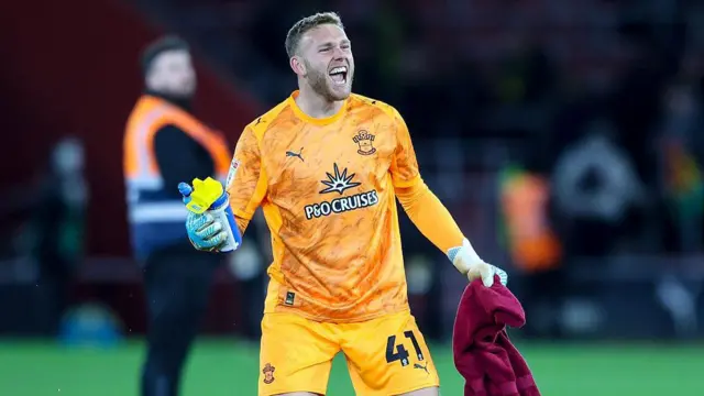 Daniel Peretz celebrates after a game in his Orange Southampton kit