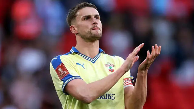 Taylor Harwood-Bellis applauds the Southampton supporters 