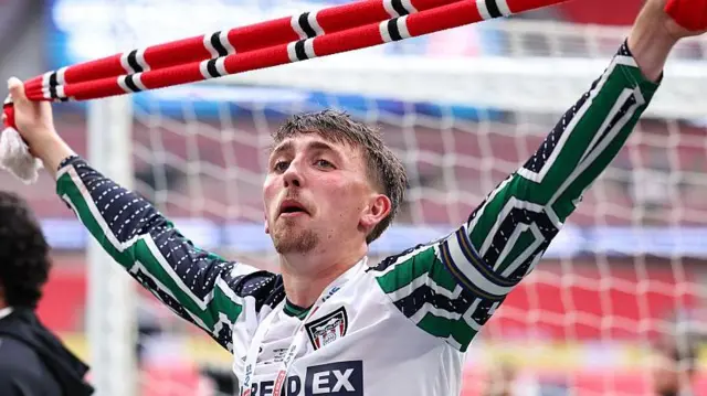 Dan Neil of Sunderland celebrates with a scarf during the Championship play-off final