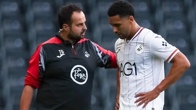 Ben Cabango gets treatment after suffering an injury against Sheffield United. 