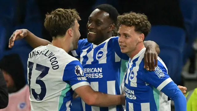 Brighton players celebrating after Danny Welbeck scored against Chelsea