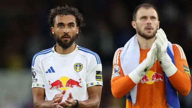 Dominic Calvert-Lewin and Lucas Perri applaud fans after match for Leeds