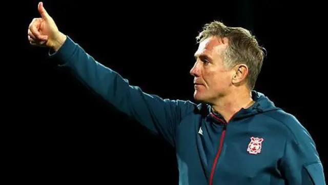 Phil Parkinson celebrates after Wrexham's win over Reading