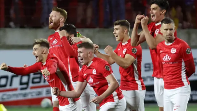 Larne players celebrate after the dramatic penalty shootout win over Kosovan champions Ballkani