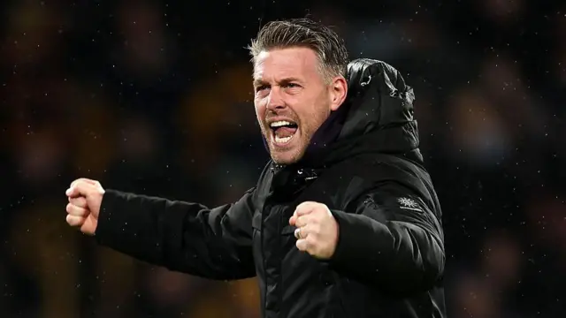 Rob Edwards celebrates