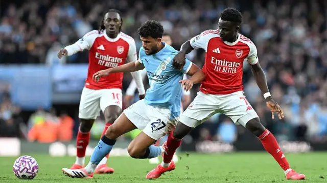Eberechi Eze and Bukayo Saka playing for Arsenal