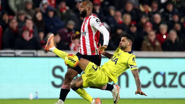 Igor Thiago of Brentford is challenged by Cristian Romero of Tottenham Hotspur