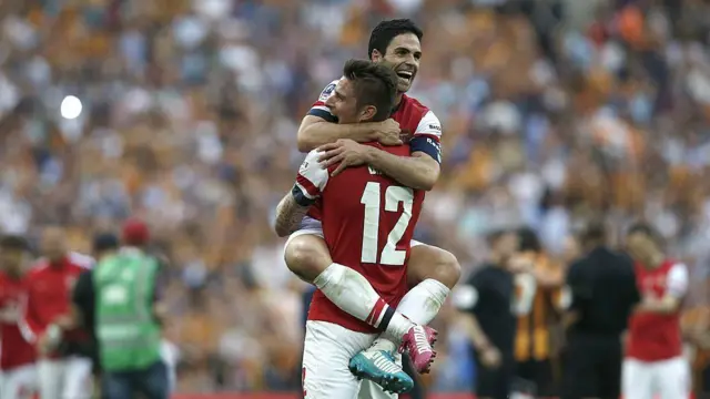 Olivier Giroud and Mikel Arteta celebrate winning the FA Cup