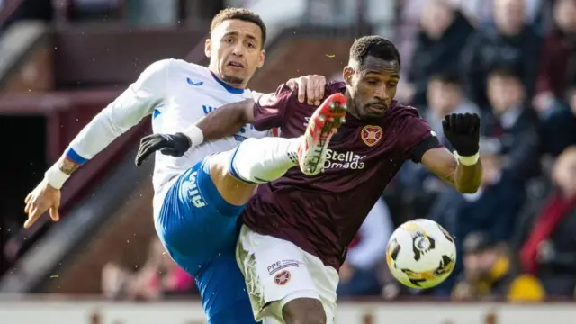 Rangers' James Tavernier and Hearts' Elton Kabangu 