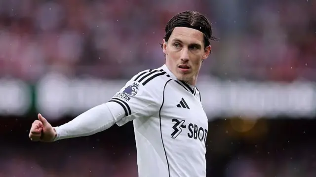Harry Wilson gesturing a thumbs up