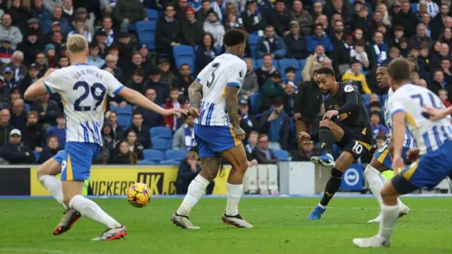 Matheus Cunha of Wolverhampton Wanderers scores a goal to make the score 2-2 during the Premier League match between Brighton & Hove Albion FC and Wolverhampton Wanderers FC at Amex Stadium on October 26, 2024