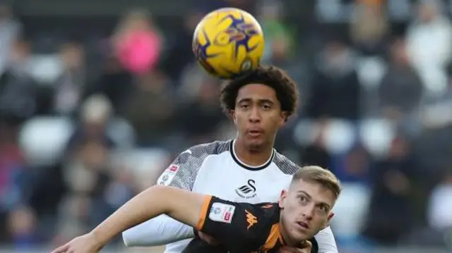 Bashir Humphreys of Swansea City challenged by Liam Delap of Hull City during the Sky Bet Championship match between Swansea City and Hull City at the Swansea.com Stadium on November 25, 2023 in Swansea, Wales.