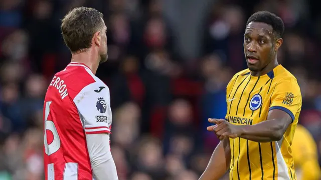 Brighton & Hove Albion's Danny Welbeck in discussion with Brentford's Jordan Henderson
