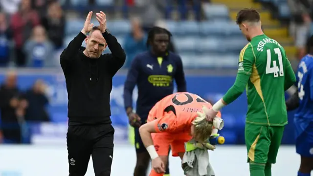 Simon Rusk applauds supporters post-match