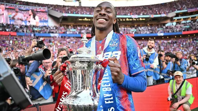 Eberechi Eze holding the FA Cup