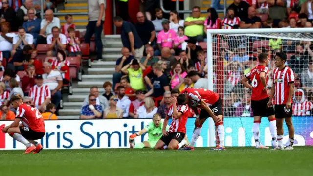 Southampton players looking dejected on the pitch at St Mary's